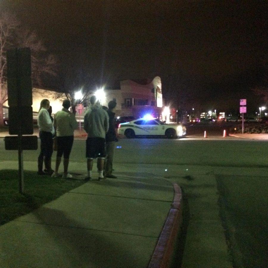 CSU students look on as campus police officers investigate a suspicious object outside of Moby Arena. The object turned out to be harmless according to police.