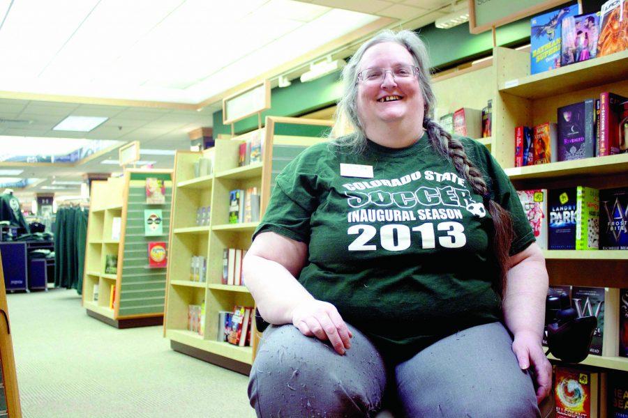 Laughing, Fran Wilson takes a break at work to talk about her life at home. Wilson has worked for the CSU bookstore for 20 years while going to school part time as a Spanish major.