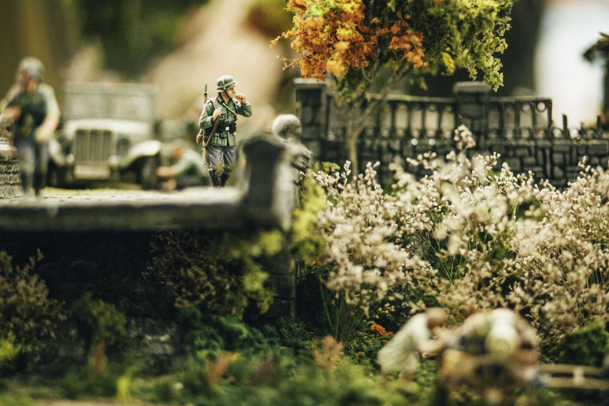 A detail shot depicting a miniature German soldier smoking in Andres Flores' diorama titled "Blitzkrieg." Paying close attention to detail, Flores recreates in miniature form German movement through France in 1940 via their infamous Blitzkrieg, or "lightning war," war plan.