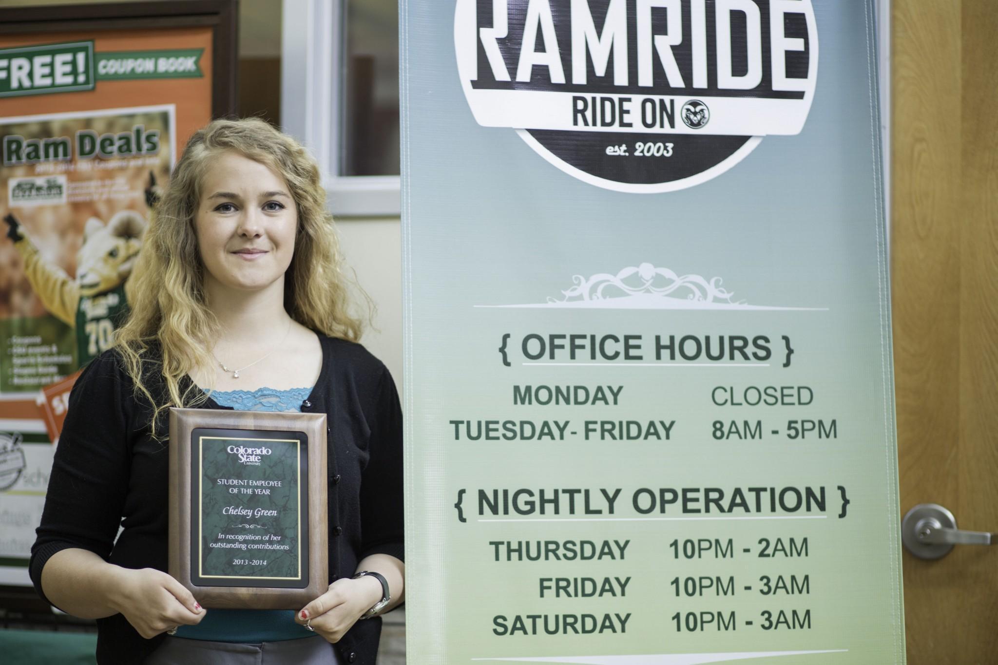Chelsey Green stands outside the RamRide office in the Lory Student Center with her plaque honoring her as the "Student Employee of the Year" Tuesday afternoon.