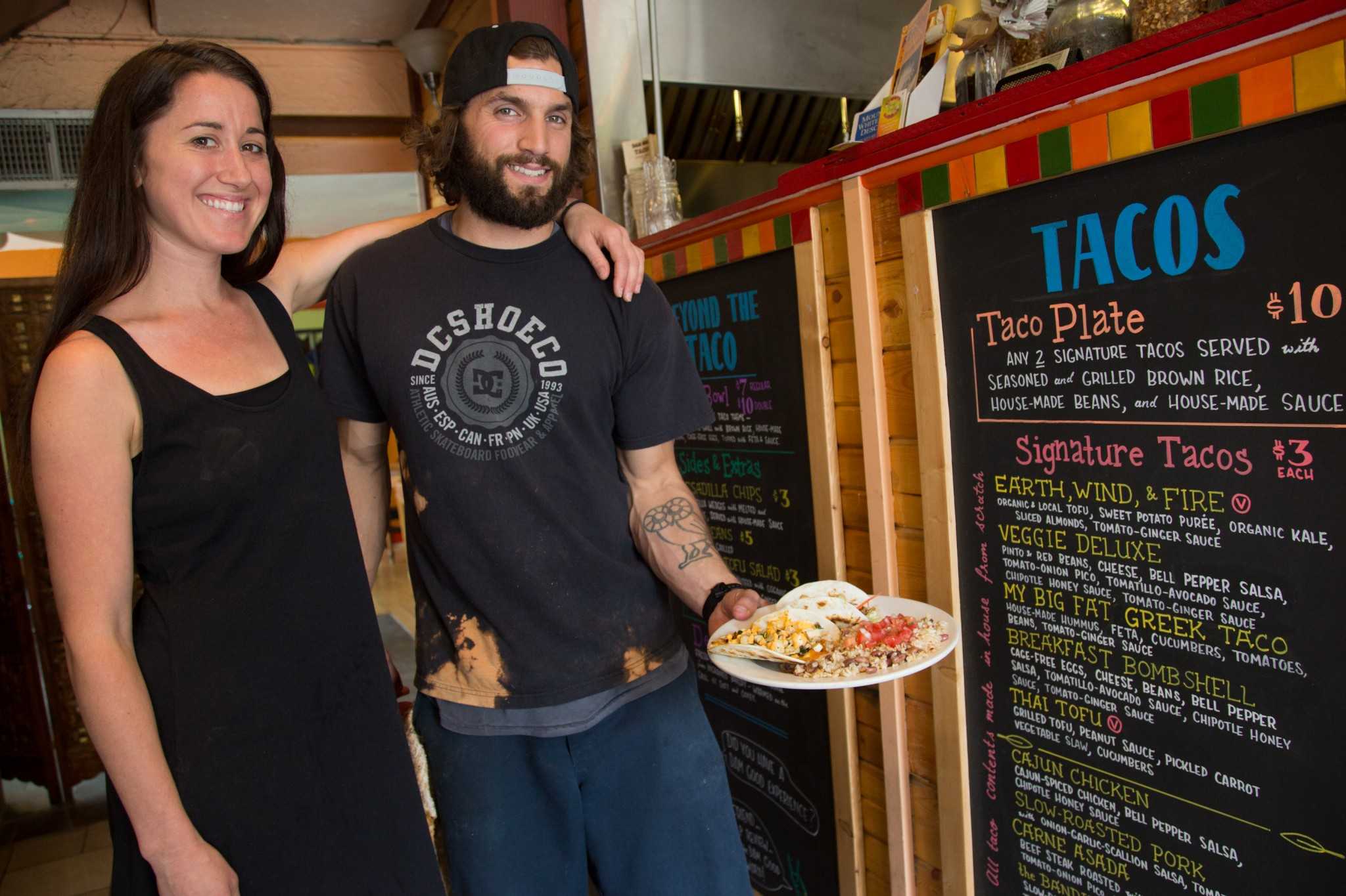 Dam Good Tacos co-owners Ali Hatcher and Michael Falco at their shop in the ally on Laurel St. Ali is a Colorado State University Public Health alum who opened the shop with Michael last June.