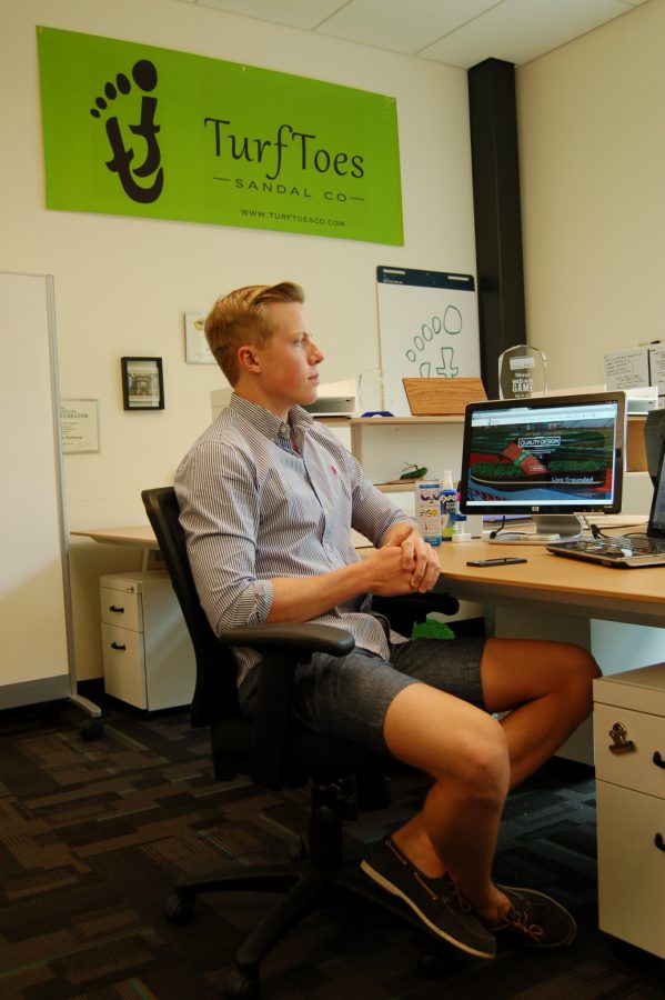 Tanner Eley, a senior majoring in bussiness, takes a brief break from his work with Turf Toes at The Hatchery.