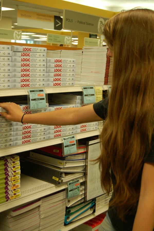 Kassi Prochazka, a freshman majoring in engineering, scans the rows of CSUs bookstore. Prochazka picked out her AUCC books at the CSU bookstore and is going to find her engineering books online.