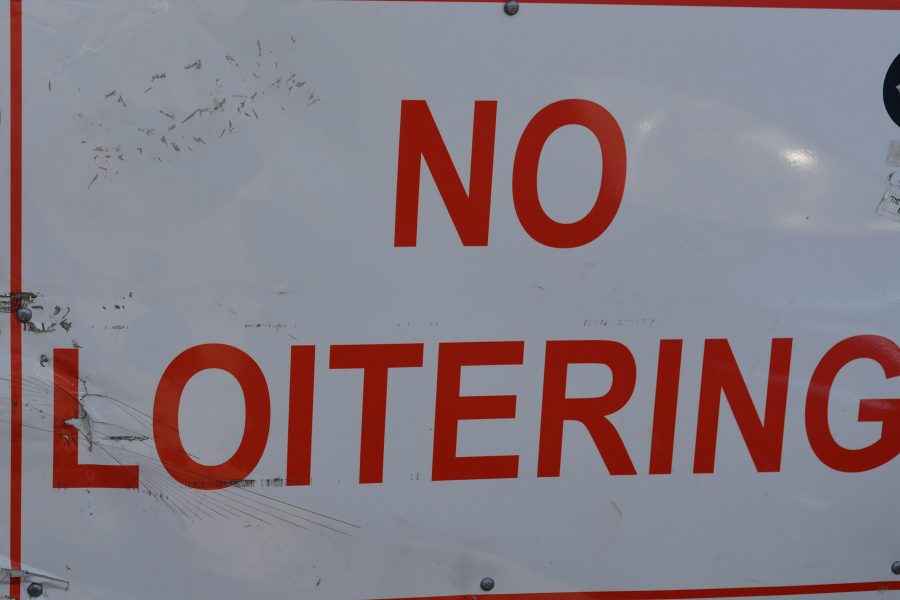 Signs advising against loitering line some Fort Collins buildings. Fort Collins Police will take action if necessary. (Photo Credit: Megan Fischer)