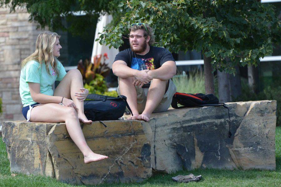 Kelly Scharlau, a sophomre majoring in biomedical engineering and Tyler Parker, a freshman majoring in biomedical engineering talk outside the Student Recreation Center before meeting some other friends to play a game of volleyball. (Photo Credit: Megan Fischer)