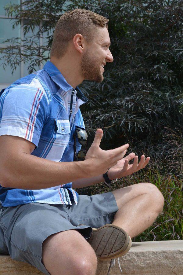 Michal Kmita, a Colorado State alumnus, expressing his passion for humanitarian development. Kmita came to campus Friday to recruit volunteers for his organization, Invictus Initiative, which takes a different approach to humanitarian development. (Photo Credit: Megan Fischer)