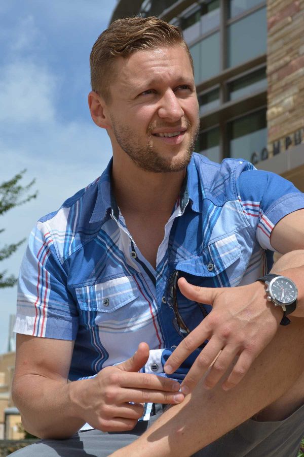 Colorado State alumnus, Michal Kmita, expressing his passion for humanitarian development. Kmita came to campus Friday to recruit volunteers for his organization, Invictus Initiative. The organization takes a different approach to humanitarian development. (Photo Credit: Megan Fischer)