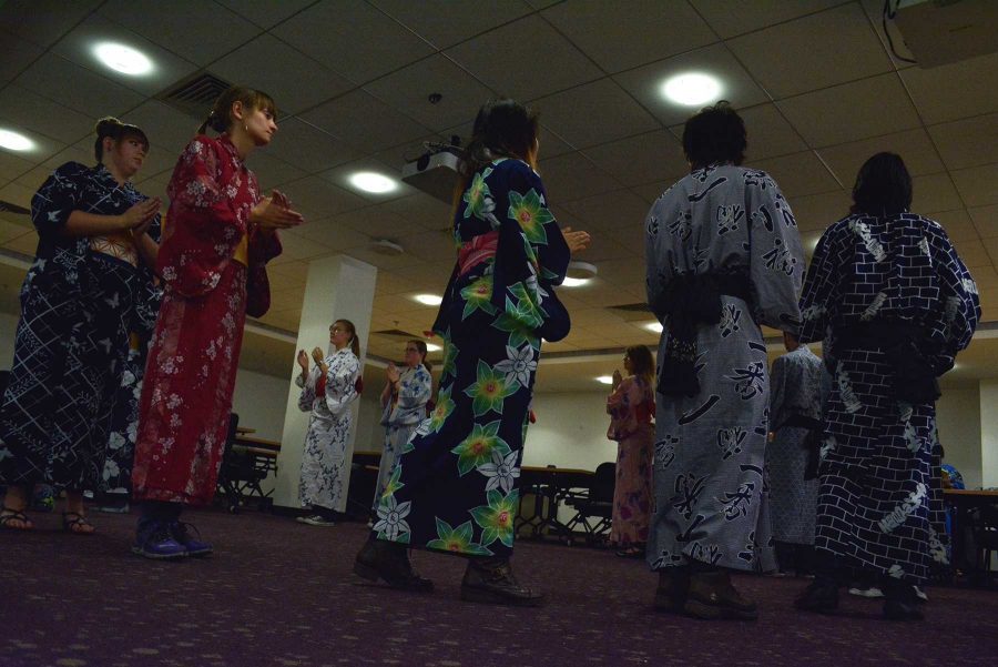 CSU students Dance to Traditional japanese music in the Morgan Library. Japanese Bon dances are traditional dances that take place in the Summer and are used to honor dead spirits.