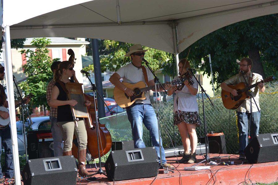Members of the Blue Grama bluegrass group play at the 2014 Xaniscape Festival put on by the Geller Center. The festival featured local vendors, food and music. (Photo Credit: Megan Fischer)