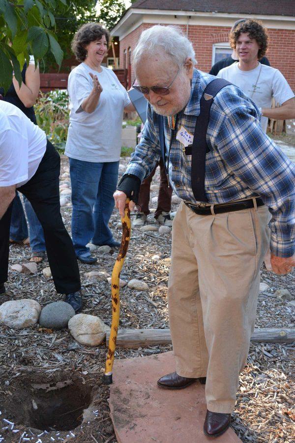 Bob Geller, founder of the Geller Center, walks away from the hole where they had composted the mortgage since the Geller Center now officially owns the land they had been wanting to get from the Synod of the Rocky Mountains of the Presbyterian Church. (Photo Credit: Megan Fischer)