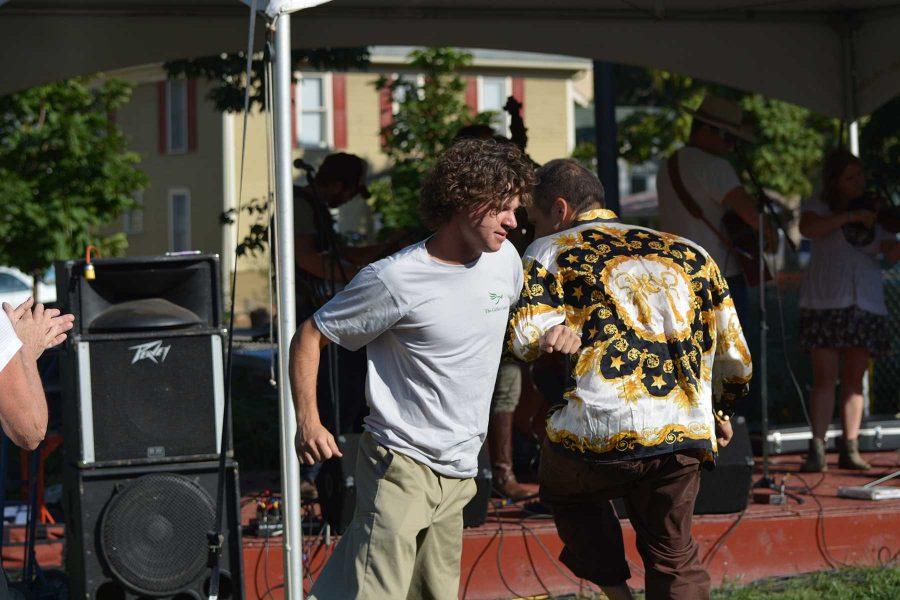 Biochemistry sophomore, Johnny Roos and Steve Dewey dance along to the Xaniscape Festival music. The event featured local bands and vendors. (Photo Credit: Megan Fischer)