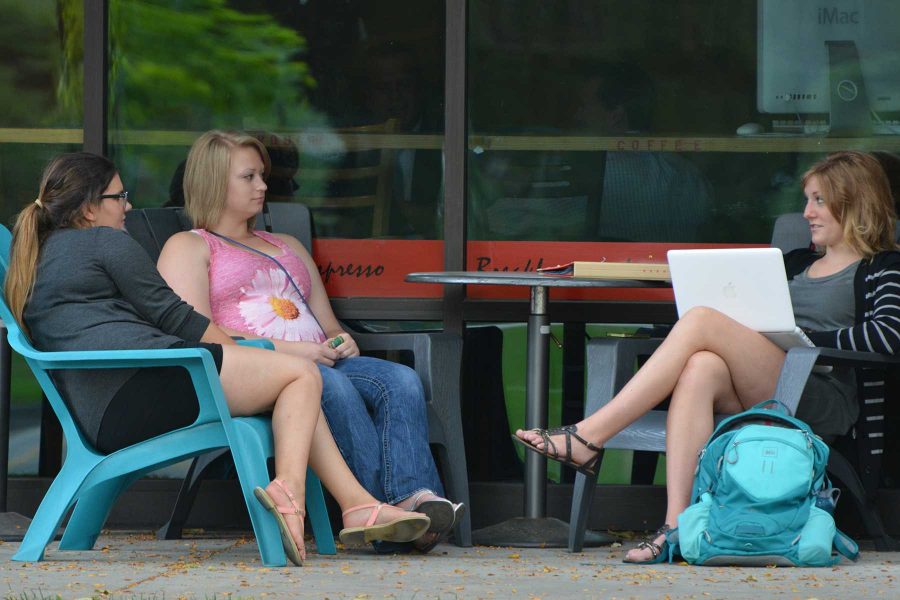 Animal science sophomore, Laila Aladwani, biology education sophomore, Mattie Becker and  junior business major, Madi Book  sit outside MUGS.