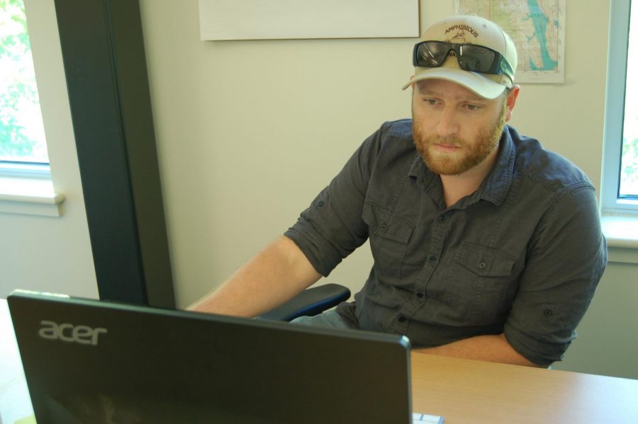 Joe Kuepper, a senior majoring in Natureal Resources Recreation and Tourism, works hard in his office located inside of The Hatchery. Kuepper's business, GreyFall, offers land navigation and survival courses.