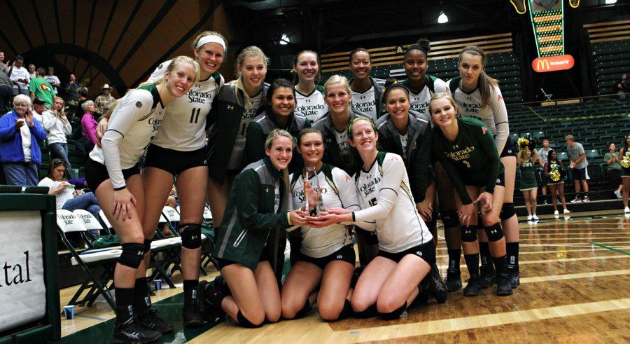 The Colorado State volleyball team celebrates its victory over Marquette in the championship match of the Rams Classic. Photo by: Dan Byers/CSU Athletics
