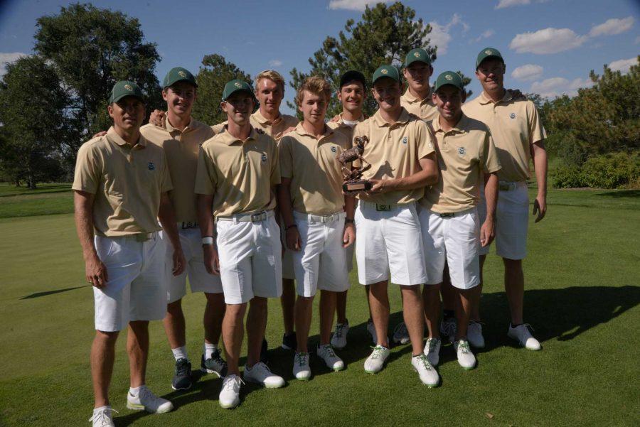 CSU men's golf team holds their first-place trophy from the 2014 Ram Masters Invitational. (Photo credit: Don Reichert/CSU Athletics)