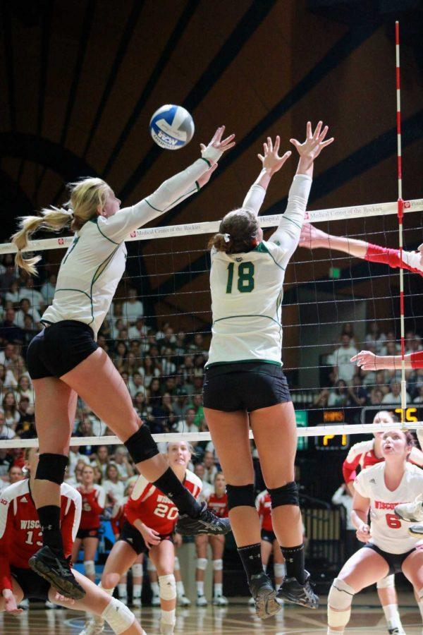 Kelsey Snider and Deedra Foss jump to block the ball against Wisconsin. Saturday night was the first loss of the season for CSU. 