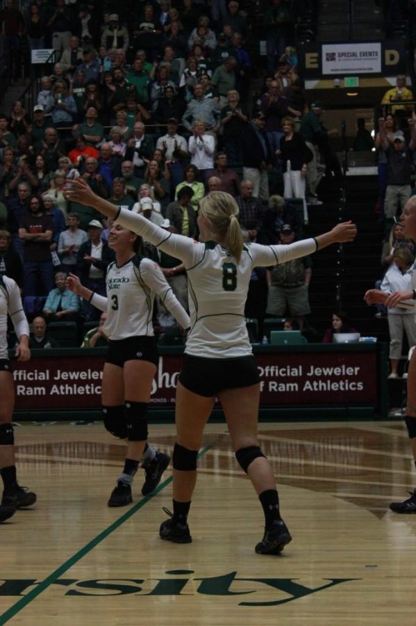 Senior health and exercise science major and defensive specialist, Kaitlind Bestgen (8), celebrates after the winning point was scored during Tuesday nights game against DU. (Photo credit: Christina Vessa)