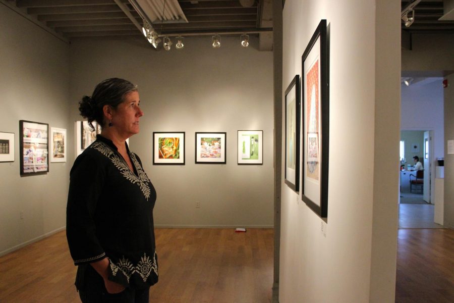Executive director of The Center for fine Art Photography Hamidah Glasgow observes the still life exhibit. 