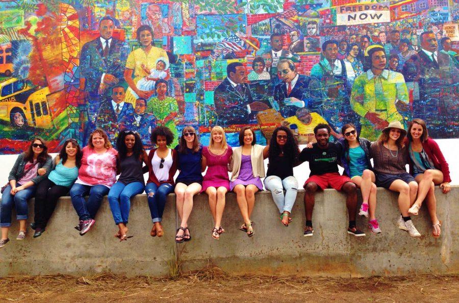 The Atlanta Alternate Spring Break group sits outside of the Martin Luther King Jr. Center at the Civil Rights Mural. This trip, along with 15 others, are offered for students to go on over spring break in 2015. (Photo credit: Caite Plunkett)