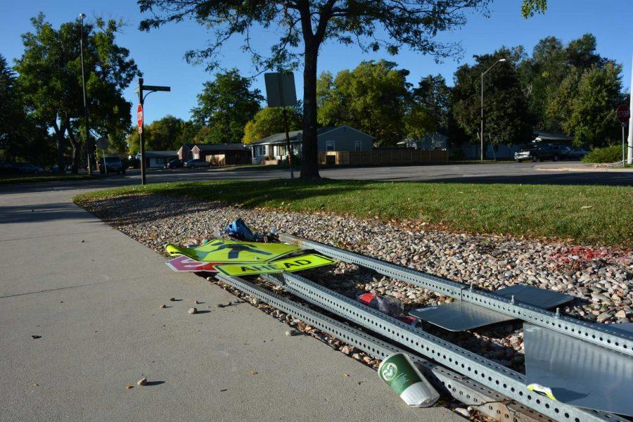 Street signs lie in a pile at the intersection of Meridian Avenue and Lake Street Sunday morning.