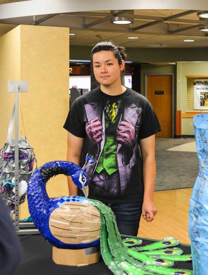 Senior mechanical engineering major, Crystal Whelan, won first place in the CSU Bookstores annual Duct Tape competition with her duct tape sculpture of a peacock. (Photo credit: Stephanie Mason)