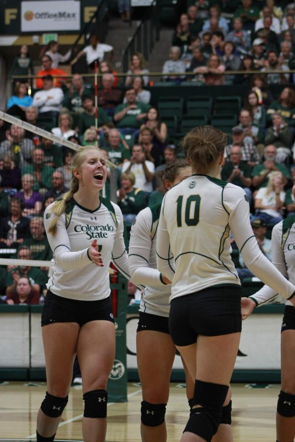 Middle blocker Kelsey Snider celebrates after the Rams score a point during Saturday's win over Fresno State at Moby Arena.