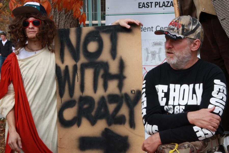 Devin Wyatt dressed as Jesus and smoked a joint holding a sign that read Not with crazy on one side and 