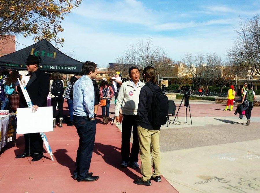 George Leing talks to political science and economics major Terran Hause on the CSU Plaza. 