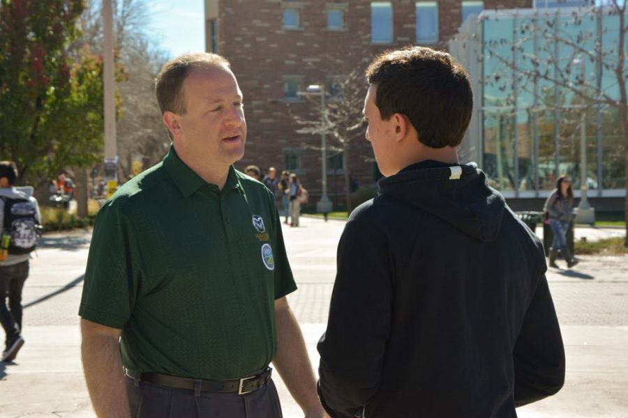 Andre Foltz, a junior political science major, stops on the CSU Plaza to talk to Jared Polis, D-Colo., about the importance of voting. Foltz thanked Polis for being on the CSU campus Thursday.