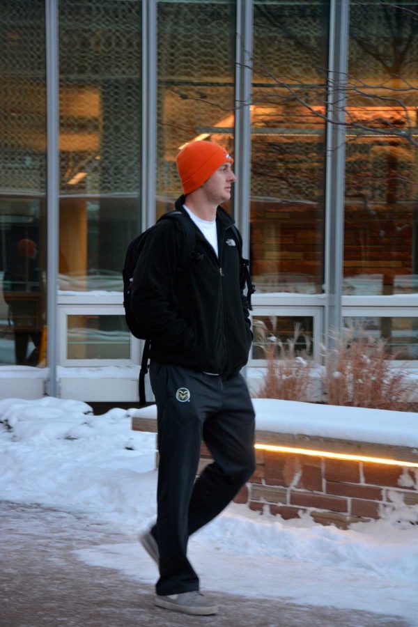 Business junior Adam Jones leaves the Morgan Library in the cold Wednesday afternoon. (Photo Credit: Megan Fischer)