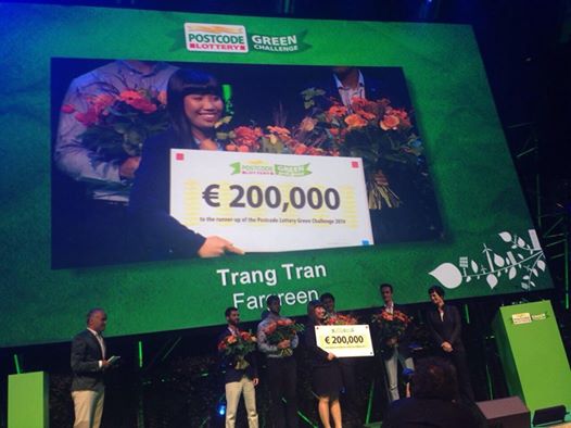 Trang Tran is presented with her 200,000 euro check at the Postcode Lottery Green Challenge in Amsterdam.