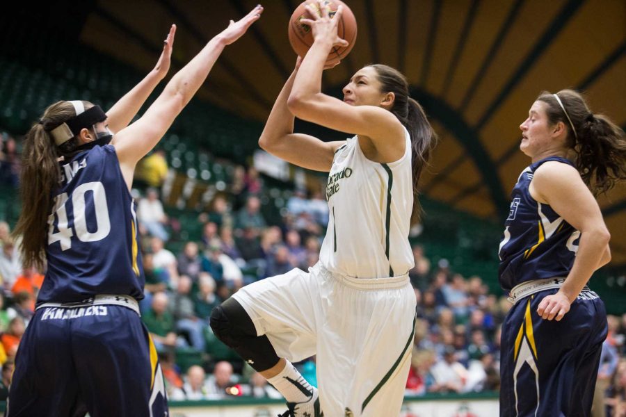 Colorado State guard Victoria Wells, center, goes for a layup during Tuesdays game at Moby Arena. (Photo by Elliot Foust)