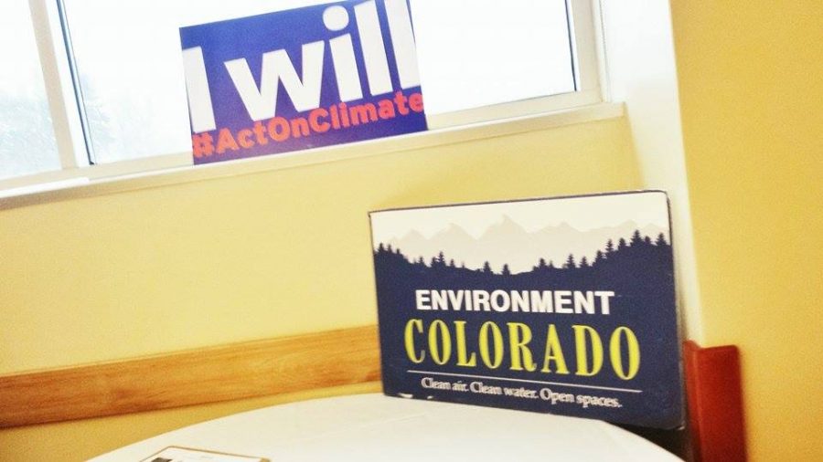 Environment Colorado posters rest on a table in the Lory Student Center, advertising their work to fight global warming. (Photo Credits: Hannah Ditzenberger) 