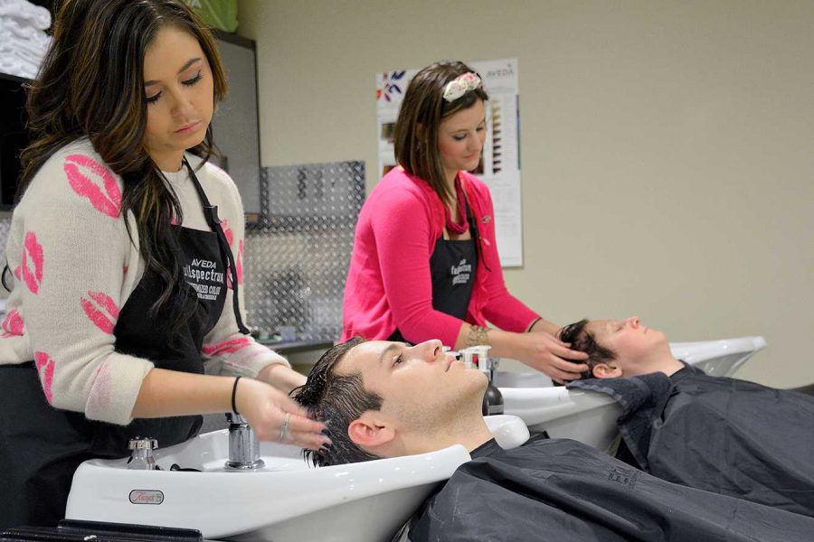 Communications sophomore, Austin Carrese, gets a wash and scalp massage by Alex Richardson while at the new on-campus salon in the Lory Student Center. (Photo credit: Emma Brokaw)