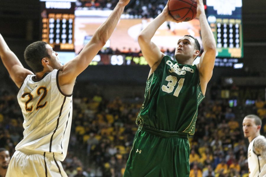 J.J. Avila shoots over Wyoming's Larry Nance Jr. in February of 2015. (Photo by Abbie Parr)