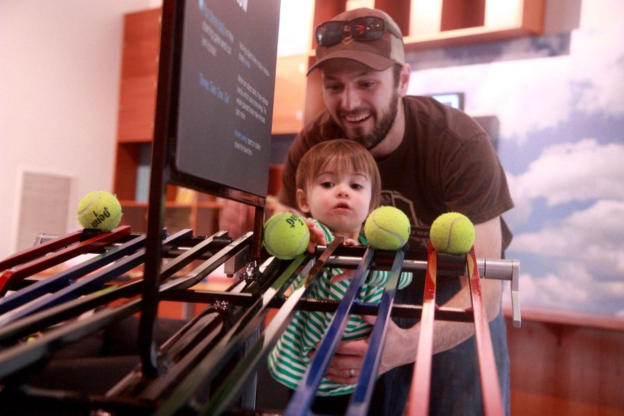 Steven Williams and his daughter Lillian play with the Energy at Rest exhibit at Fort Collins Museum of Discovery. The museum has a whole host of fun, interactive exhibits for families and individuals to enage in and learn something new. (Photo: Madison Brandt)
