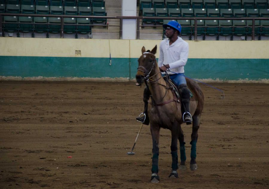 Kareem Rosser, a junior and captain of the polo team, has a calm moment during the team's practice Wednesday afternoon.