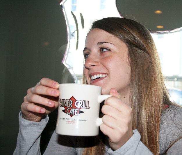 Student drinks a cup of coffee at Silver Grill Cafe. 