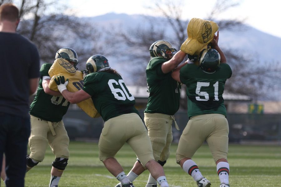 Colorado State offensive linemen battle during blocking drills at a recent practice. (Photo by Abbie Parr)