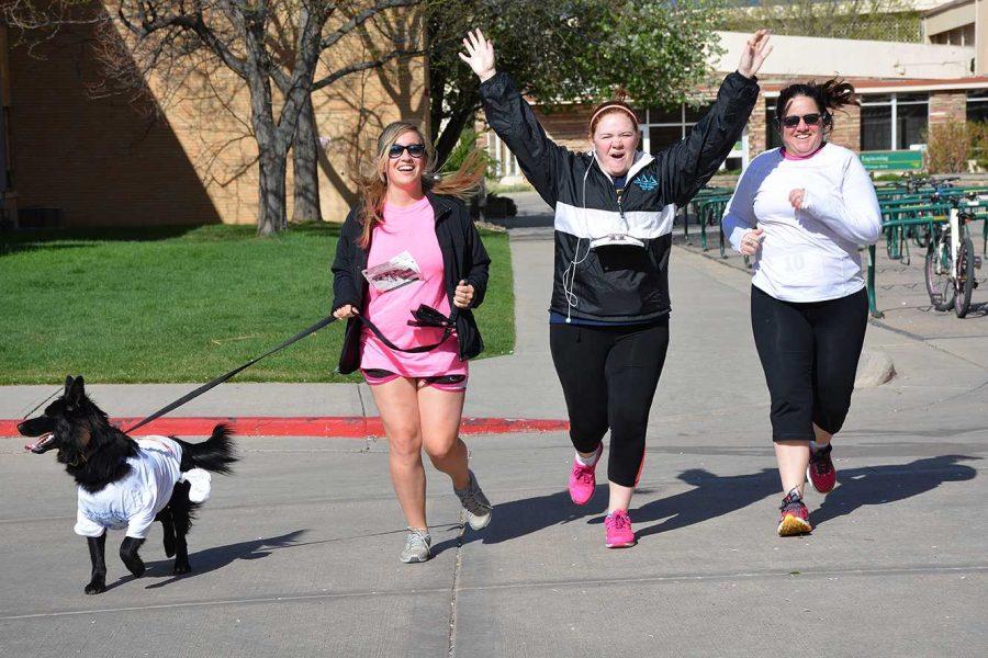 Shannon Hae and Spencer and April Gudenrath, run to the finish line of Alpha Epsilon Pis Gift of Life Bone Marrow Foundation 5K.