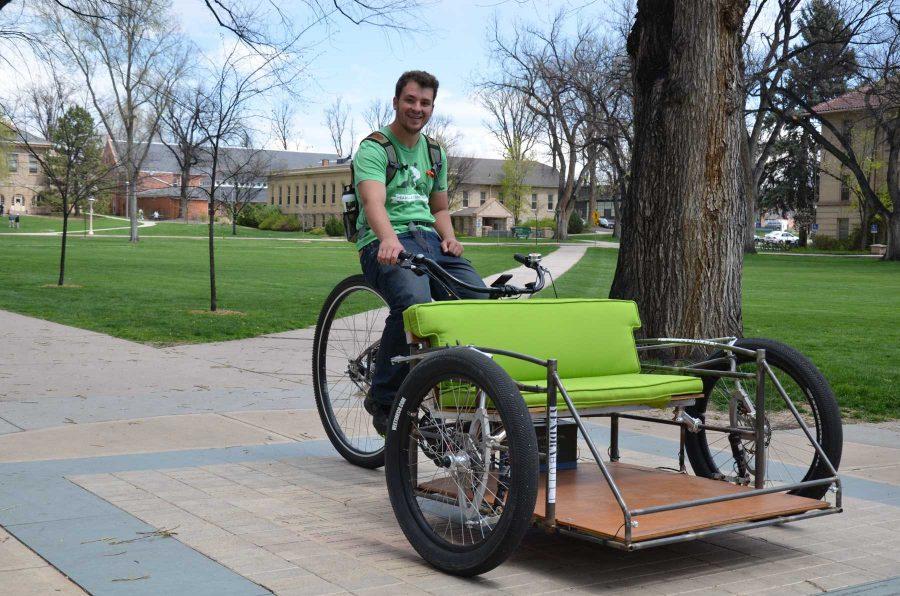 CSU graduate Kevin Kruglat takes a little break from giving students free rides around campus to take a few photos in the Oval on Thursday.  Kruglat and his business partner recently started the business called Tadpole Pedicabs. The name is insprired by the tadpole style pedicab that puts the rider in front of the driver. 