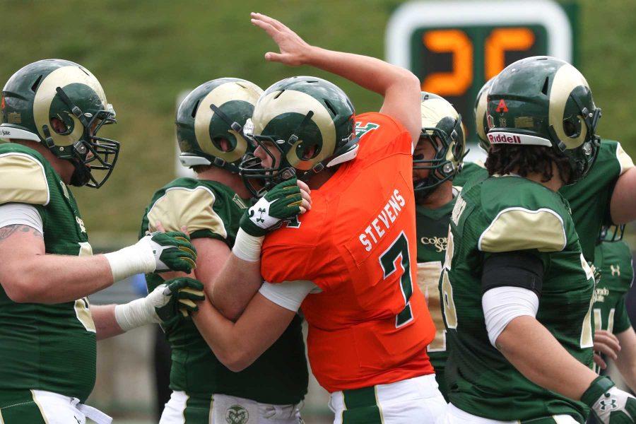 Colorado State quarterback Nick Stevens, (7), celebrates with teammates during Saturday's Green and Gold Game at Hughes Stadium. (Photo by Abbie Parr)