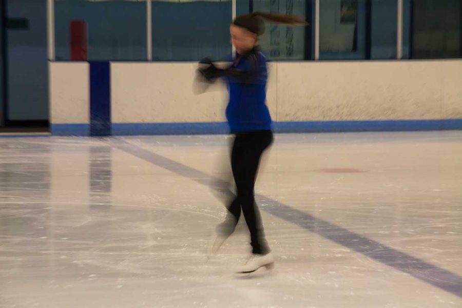 Senior English major, Nicole Sutton spins with grace over at EPIC Wednesday morning — her dedication to figure skating came through in her over nine years of experience as she practiced. (Photo credit: Kevin Olson)