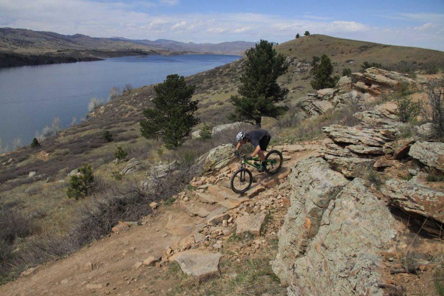 Emmett Subka, rider for the CSU Mountain Biking Team, rages down a rock stair set up at Horsetooth Reservoir just west of campus. Photo by Kevin Olson.