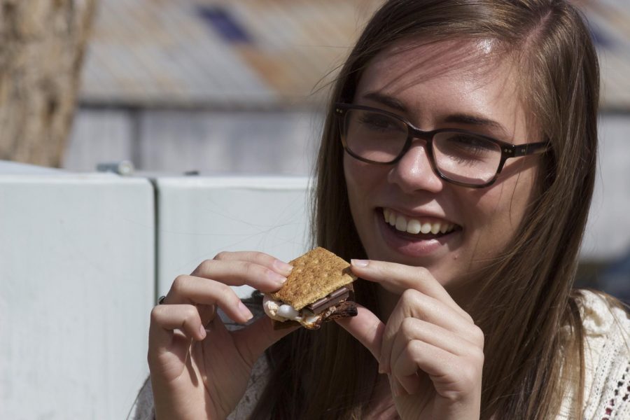 Clarissa Davies, a sophomore journalism major, enjoys an organic smore made with cinnamon graham crackers.