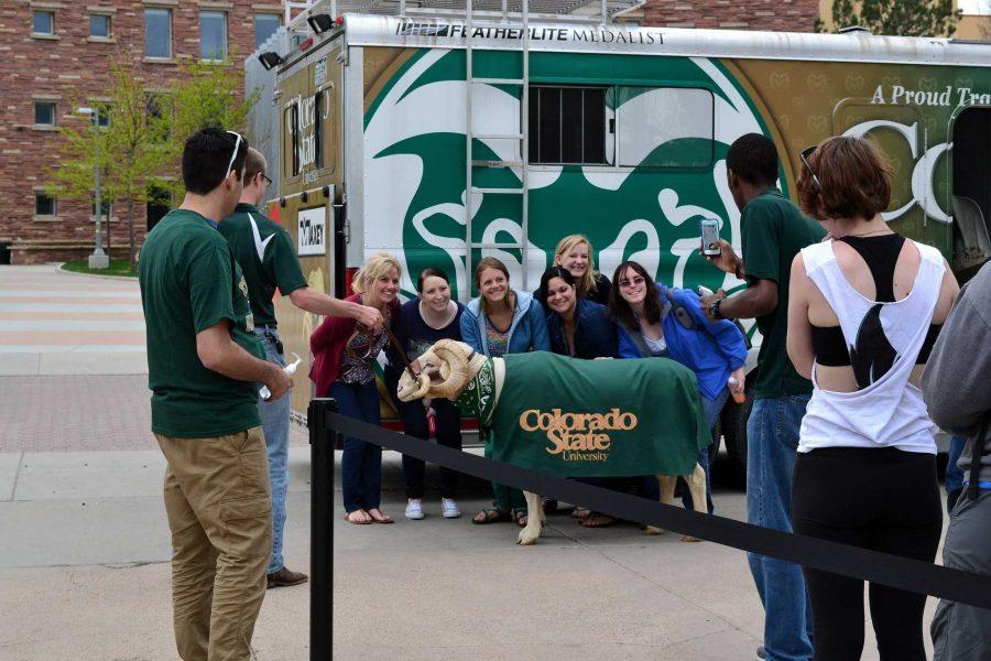 Cam the ram makes a special appearance at the May Day celebration and poses for pictures with fellow students on the plaza. 