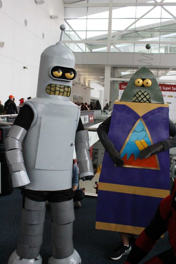 Although Comic Con originated as a convention for comic book fans, cosplay costumes have expanded to include a myriad of pop culture icons, including Bender and Reverend Lionel Preacherbot from Futurama. (Photo credit: Katie Schmidt)