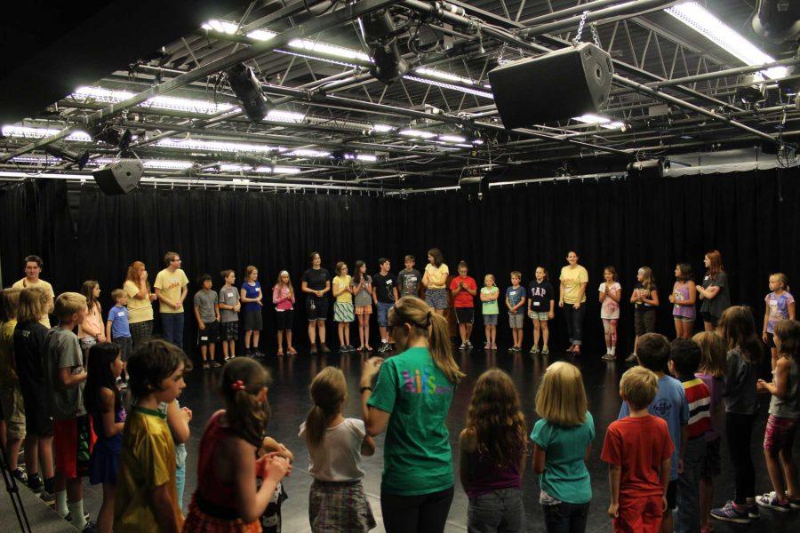 CSU students and kids work together to create plays from the kid's imaginations at the Kids Do It All summer camp. (Photo Credit: Chapman Croskell)