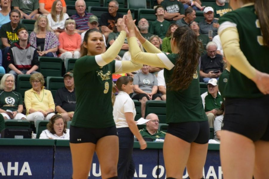 CSU seniors Crystal Young and Alex Reid celebrate a point during the Rams 3-0 sweep of UC Davis. (Photo by Megan Fischer)