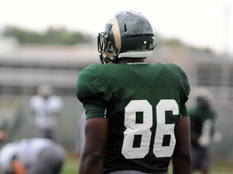 Kivon Cartwright watches from the sideline during Monday's practice. (Photo by Emmett McCarthy)
